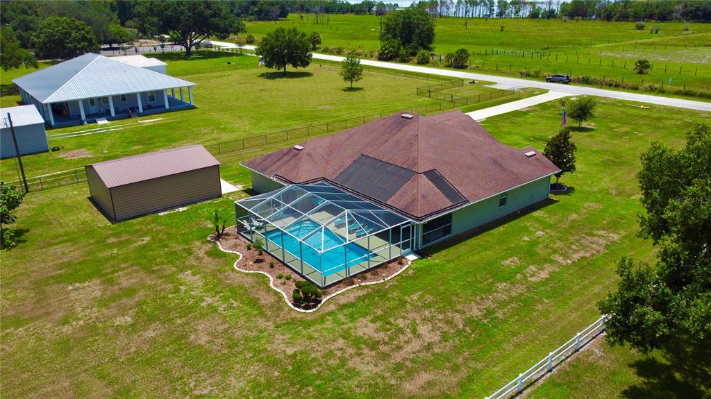 3934 Connersville Road Bartow, FL 33830 - Photo 62 of 81 an aerial view of a house with swimming pool garden and outdoor seating