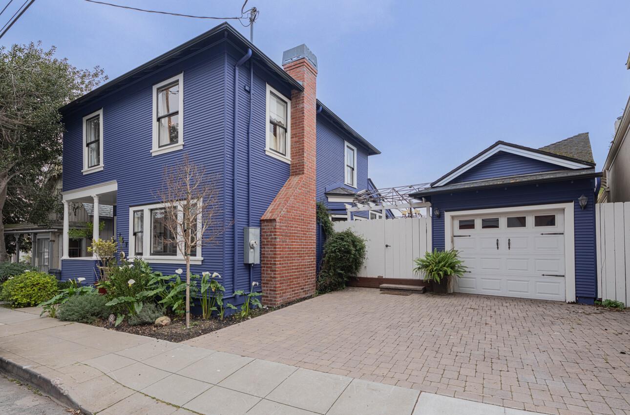 157 15th Street Pacific Grove, CA 93950 - Photo 1 of 41 a front view of a house with a yard and garage