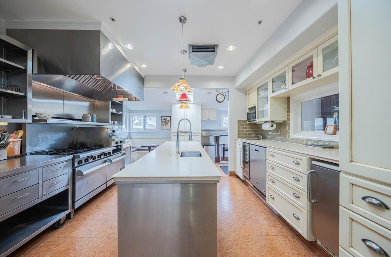 157 15th Street Pacific Grove, CA 93950 - Photo 15 of 41 a large kitchen with stainless steel appliances lots of counter space and a sink