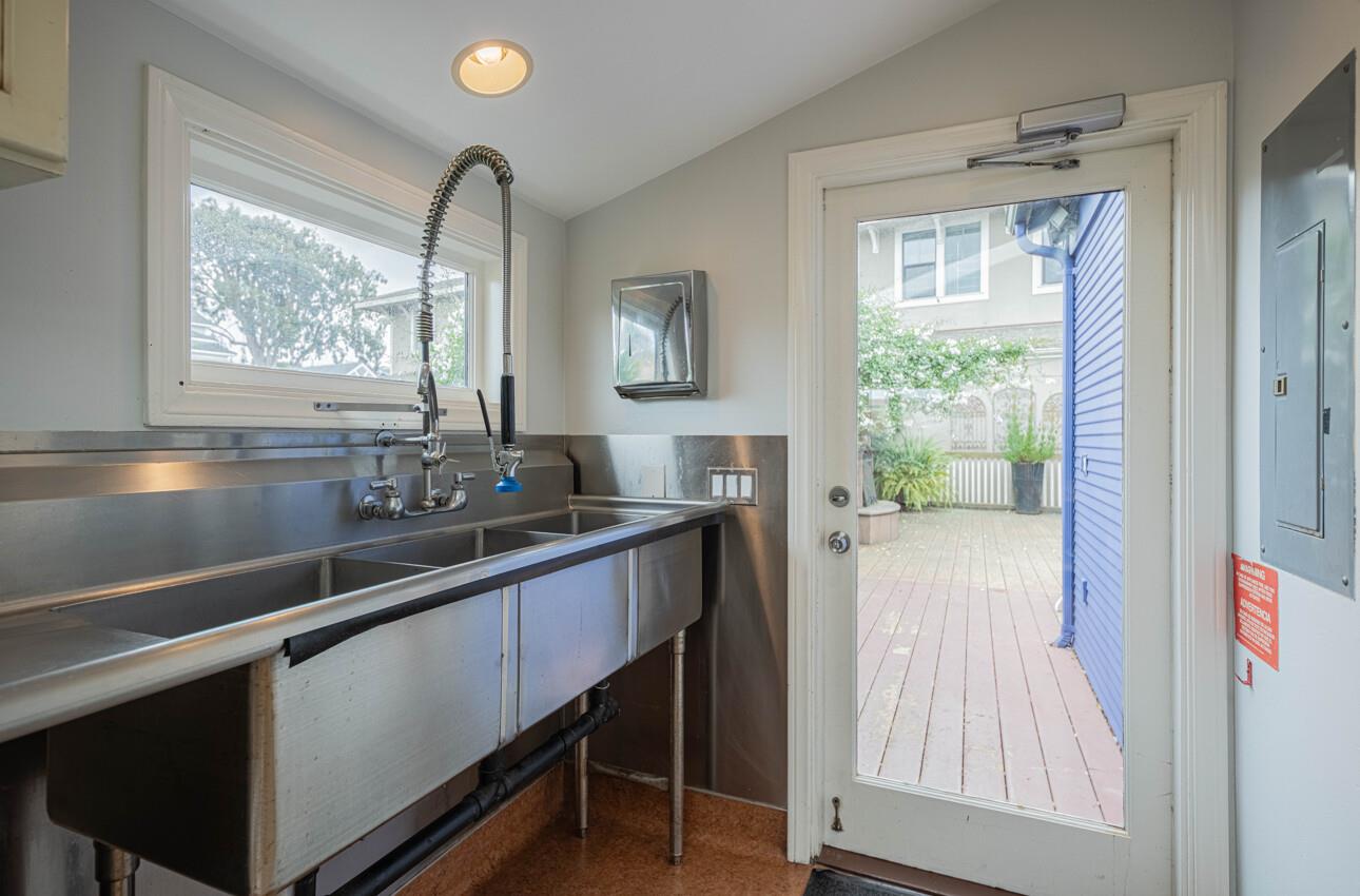 157 15th Street Pacific Grove, CA 93950 - Photo 21 of 41 a kitchen with a sink and large window