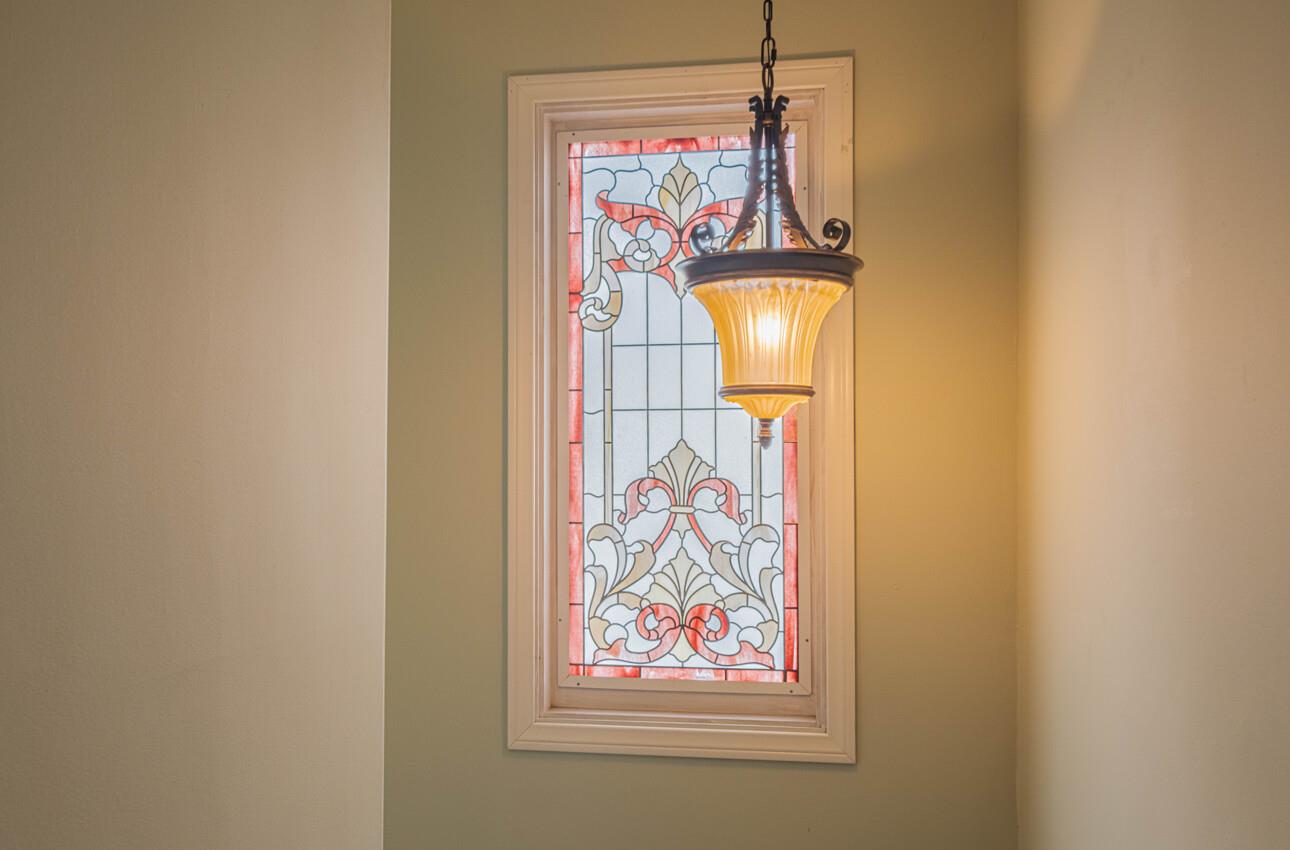 157 15th Street Pacific Grove, CA 93950 - Photo 28 of 41 a room with a painting on the wall and a window