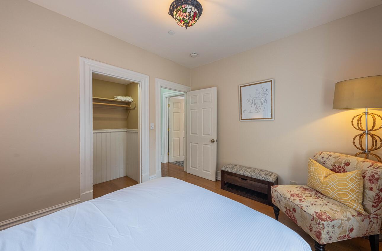 157 15th Street Pacific Grove, CA 93950 - Photo 30 of 41 a bedroom with a bed and a window