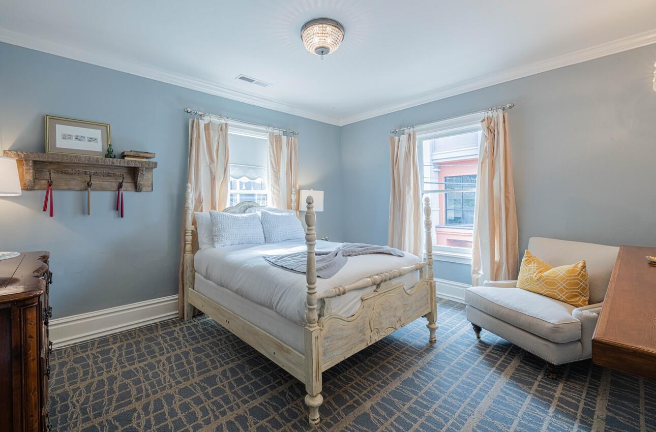 157 15th Street Pacific Grove, CA 93950 - Photo 31 of 41 a bed room with a bed and a couch