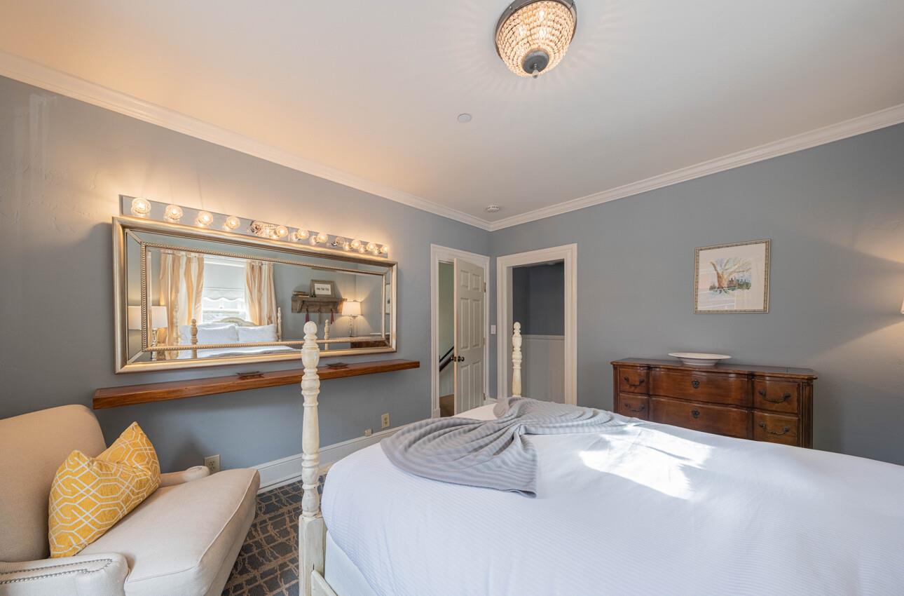157 15th Street Pacific Grove, CA 93950 - Photo 32 of 41 a bedroom with a bed and dresser