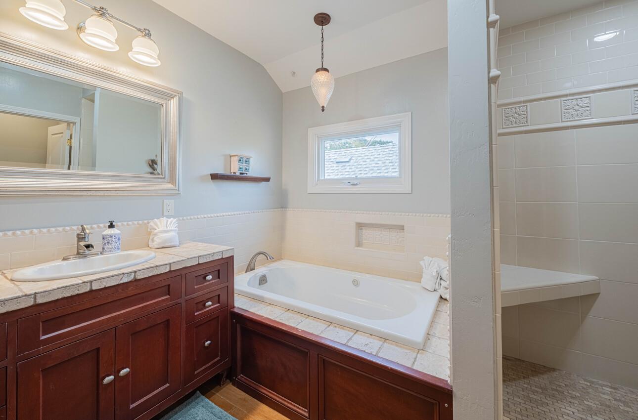157 15th Street Pacific Grove, CA 93950 - Photo 36 of 41 a bathroom with a sink and a bathtub