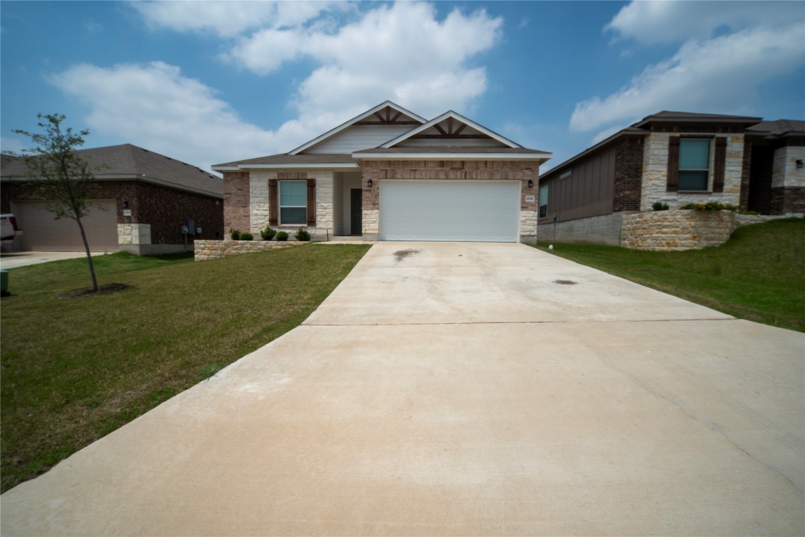 2208 Chia Court Temple, TX 76501 - Photo 1 of 16 a front view of a house with garden