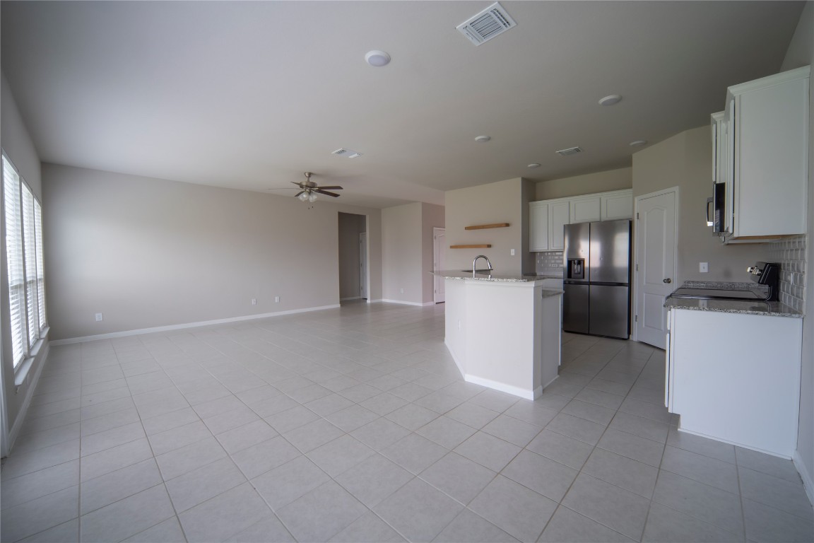 2208 Chia Court Temple, TX 76501 - Photo 16 of 16 a view of a kitchen with a sink stove and a refrigerator