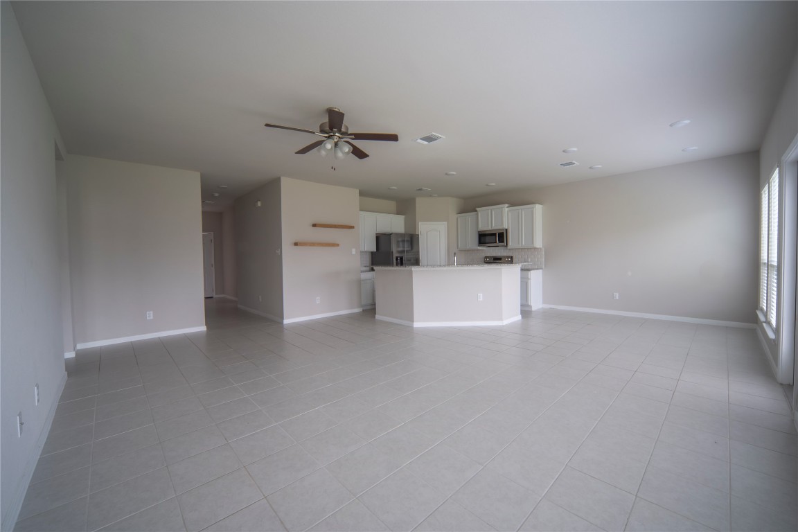 2208 Chia Court Temple, TX 76501 - Photo 3 of 16 a view of a kitchen with a sink and a refrigerator