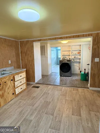wooden floor with a bookshelf
