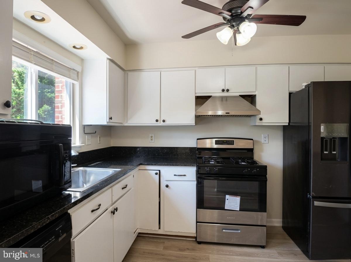 3614 Fawn Spring Court Baltimore, MD 21234 - Photo 20 of 22 a kitchen with a stove and a refrigerator