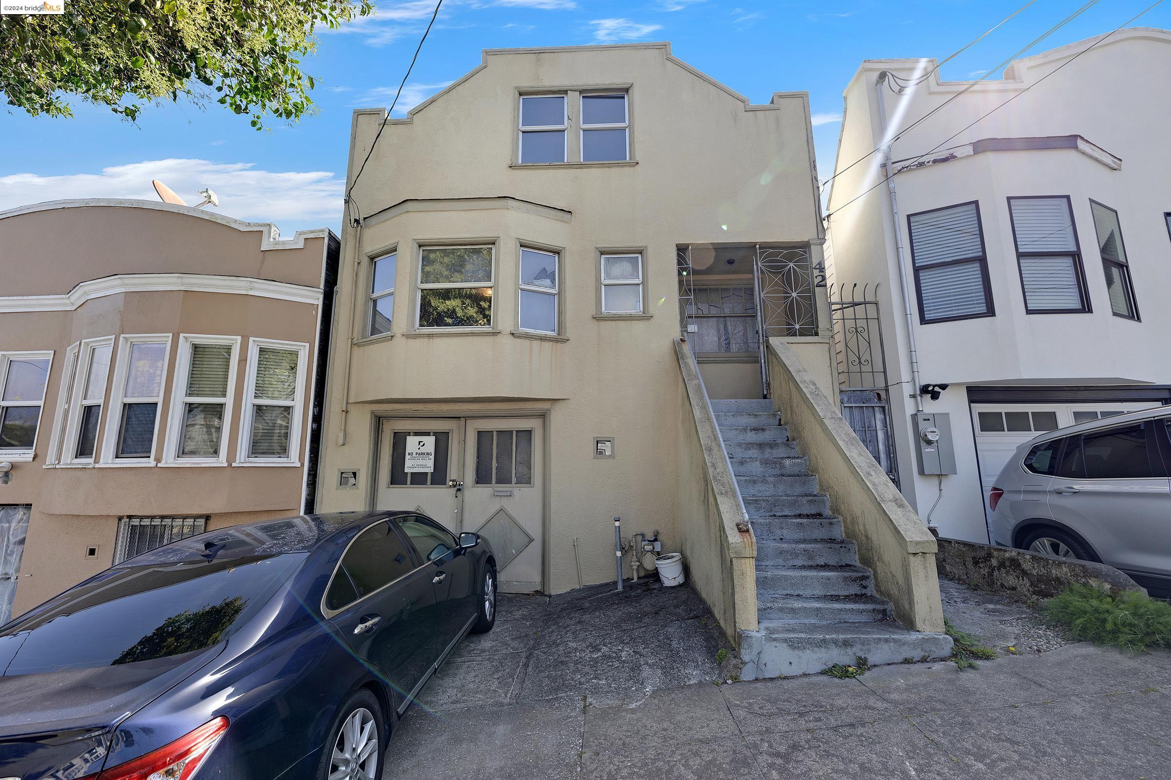 a front view of a house with many windows