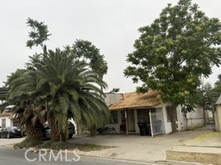 10863 Hole Riverside, CA 92505 - Photo 2 of 3 a front view of a house with a tree