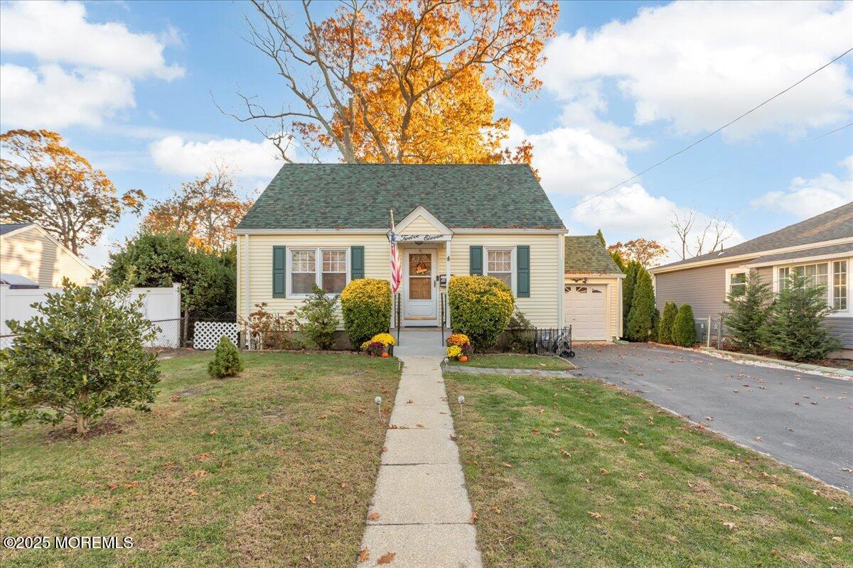 1211 18th Avenue West Belmar, NJ 07719 - Photo 2 of 40 a front view of a house with a yard and potted plants