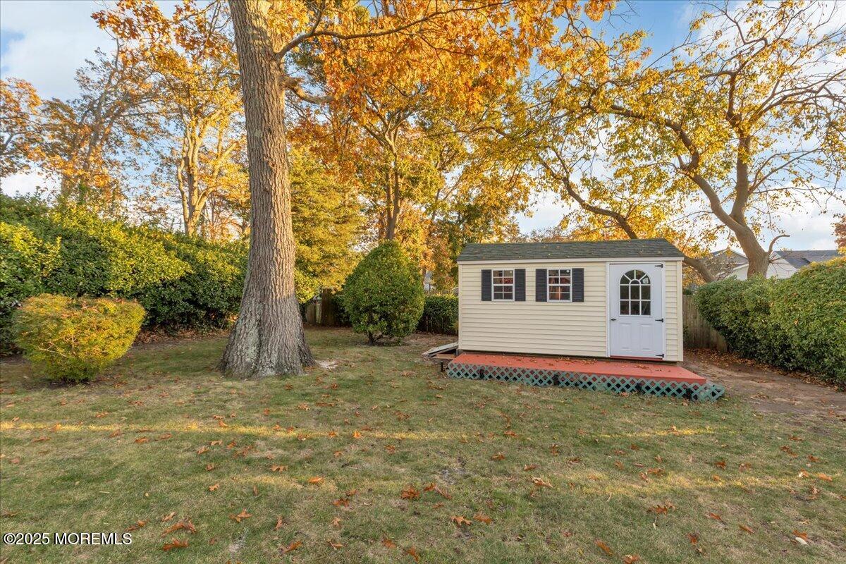 1211 18th Avenue West Belmar, NJ 07719 - Photo 33 of 40 a white house that has a tree in front of it