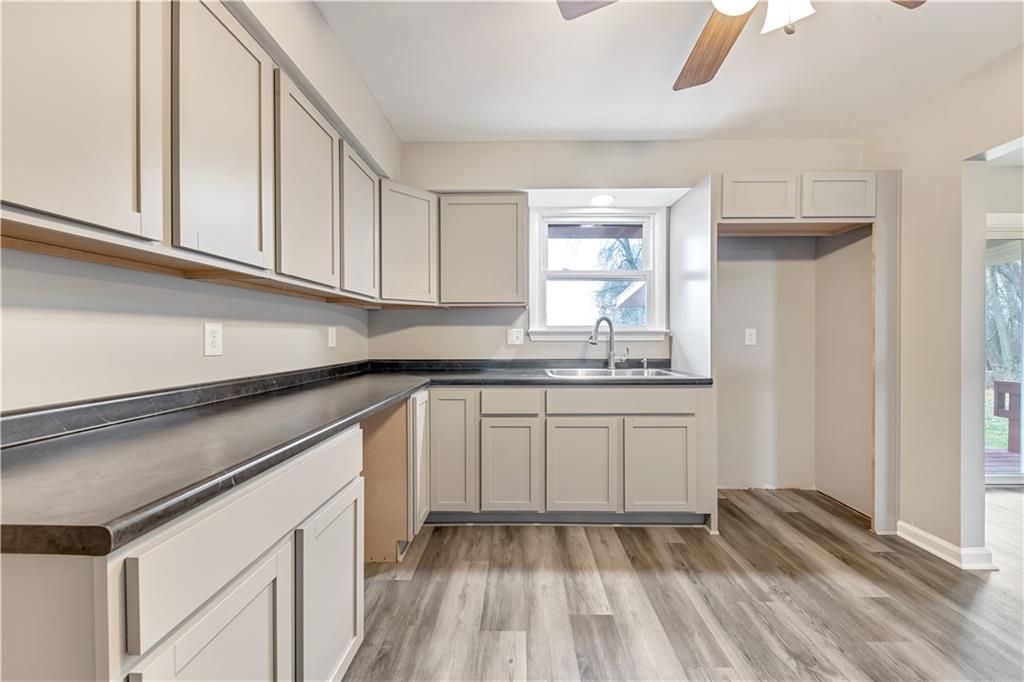 290 Bradys Ridge Road Beaver, PA 15009 - Photo 8 of 23 a kitchen with granite countertop white cabinets and white appliances