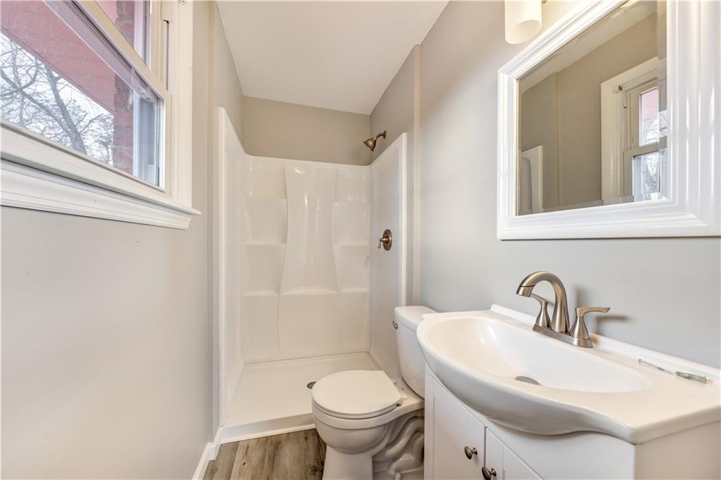 290 Bradys Ridge Road Beaver, PA 15009 - Photo 10 of 23 a bathroom with a sink toilet and a mirror