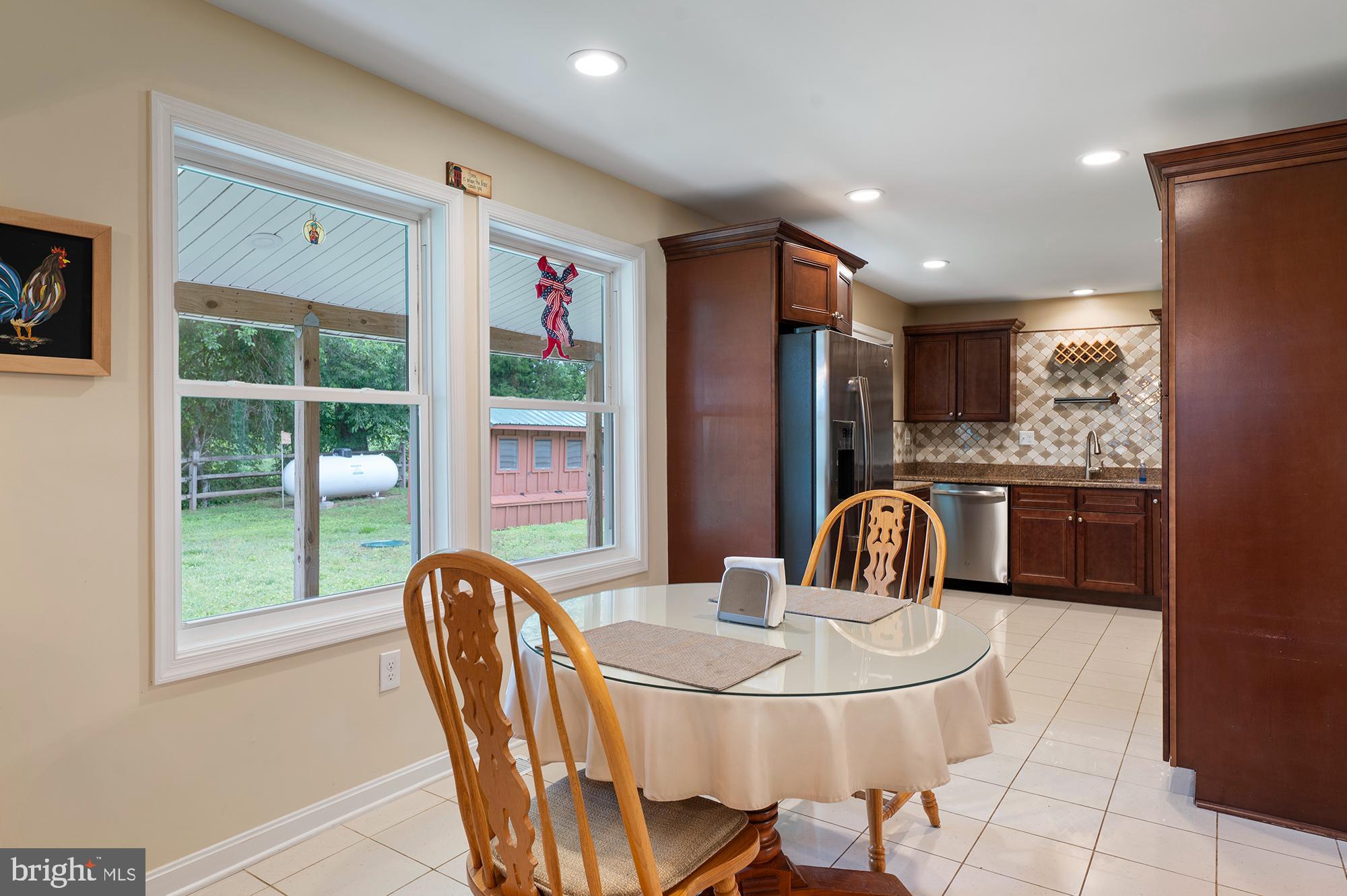 328 West Bay Front Road Lothian, MD 20711 - Photo 11 of 46 a dining room with furniture and window