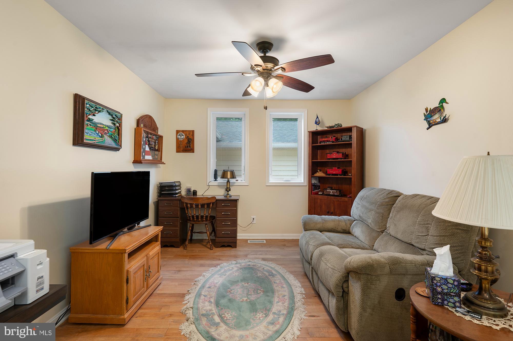 328 West Bay Front Road Lothian, MD 20711 - Photo 17 of 46 a living room with furniture and a flat screen tv