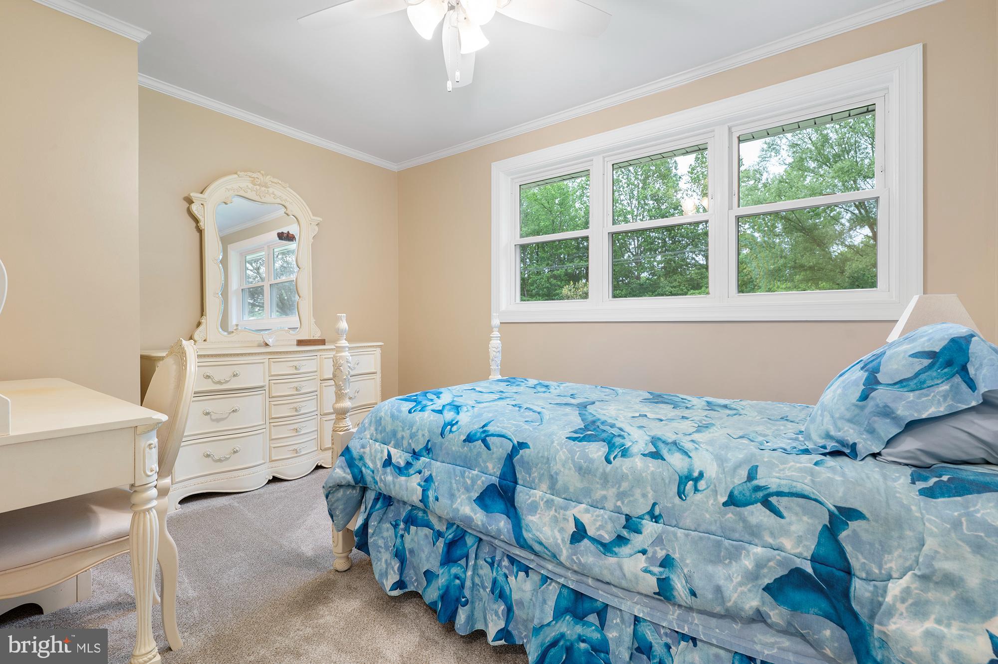 328 West Bay Front Road Lothian, MD 20711 - Photo 22 of 46 a bedroom with a bed and a window