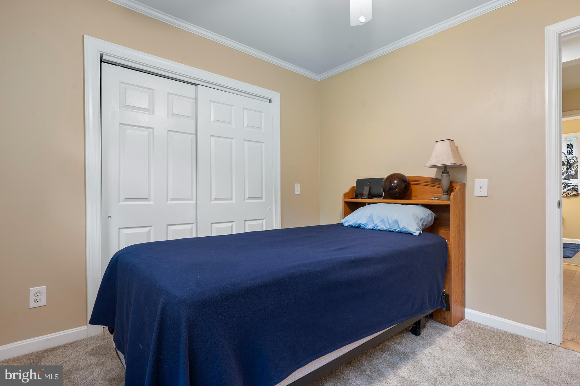 328 West Bay Front Road Lothian, MD 20711 - Photo 25 of 46 a bedroom with a bed and a window