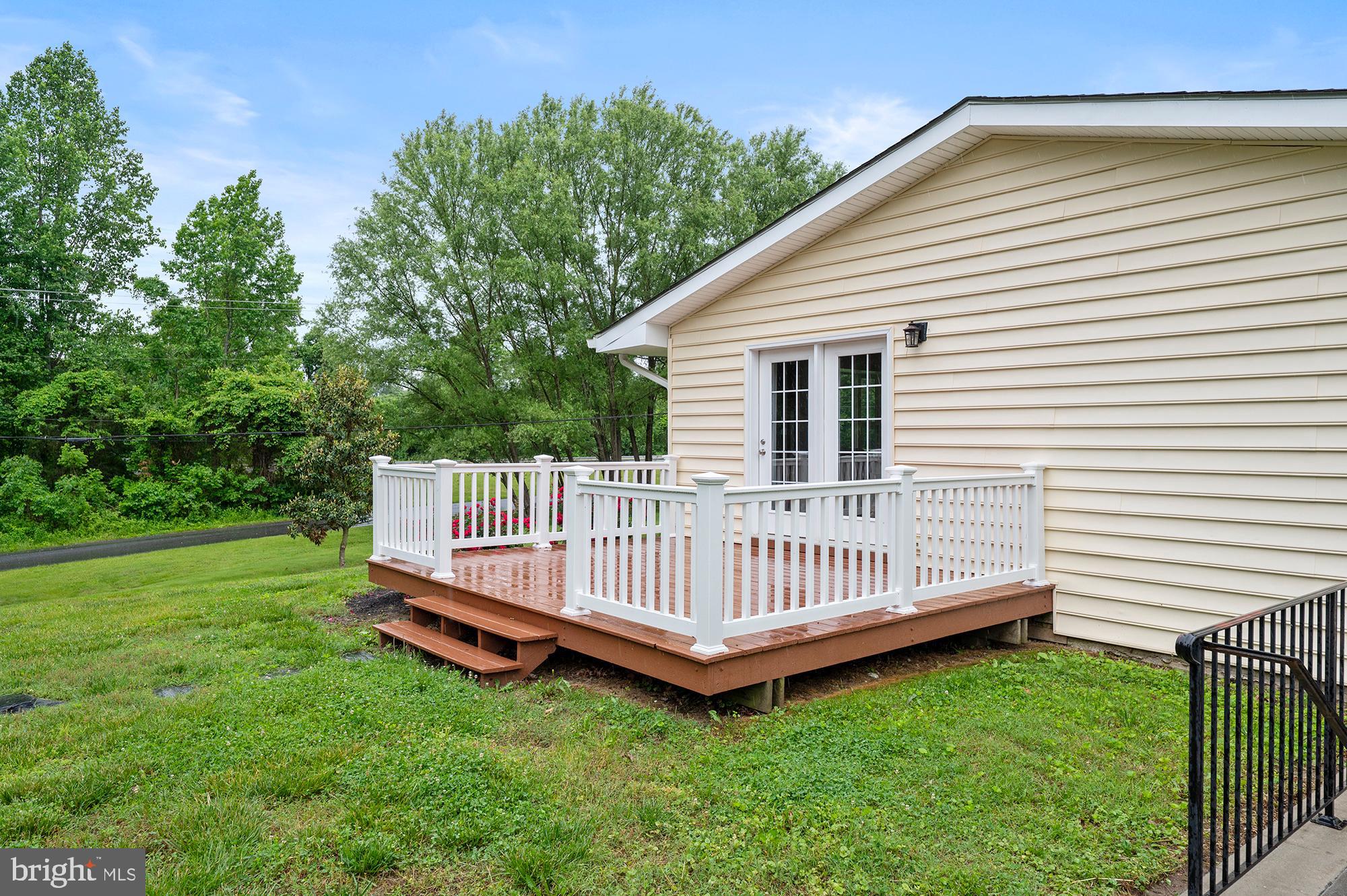 328 West Bay Front Road Lothian, MD 20711 - Photo 43 of 46 a view of a house with a yard and deck