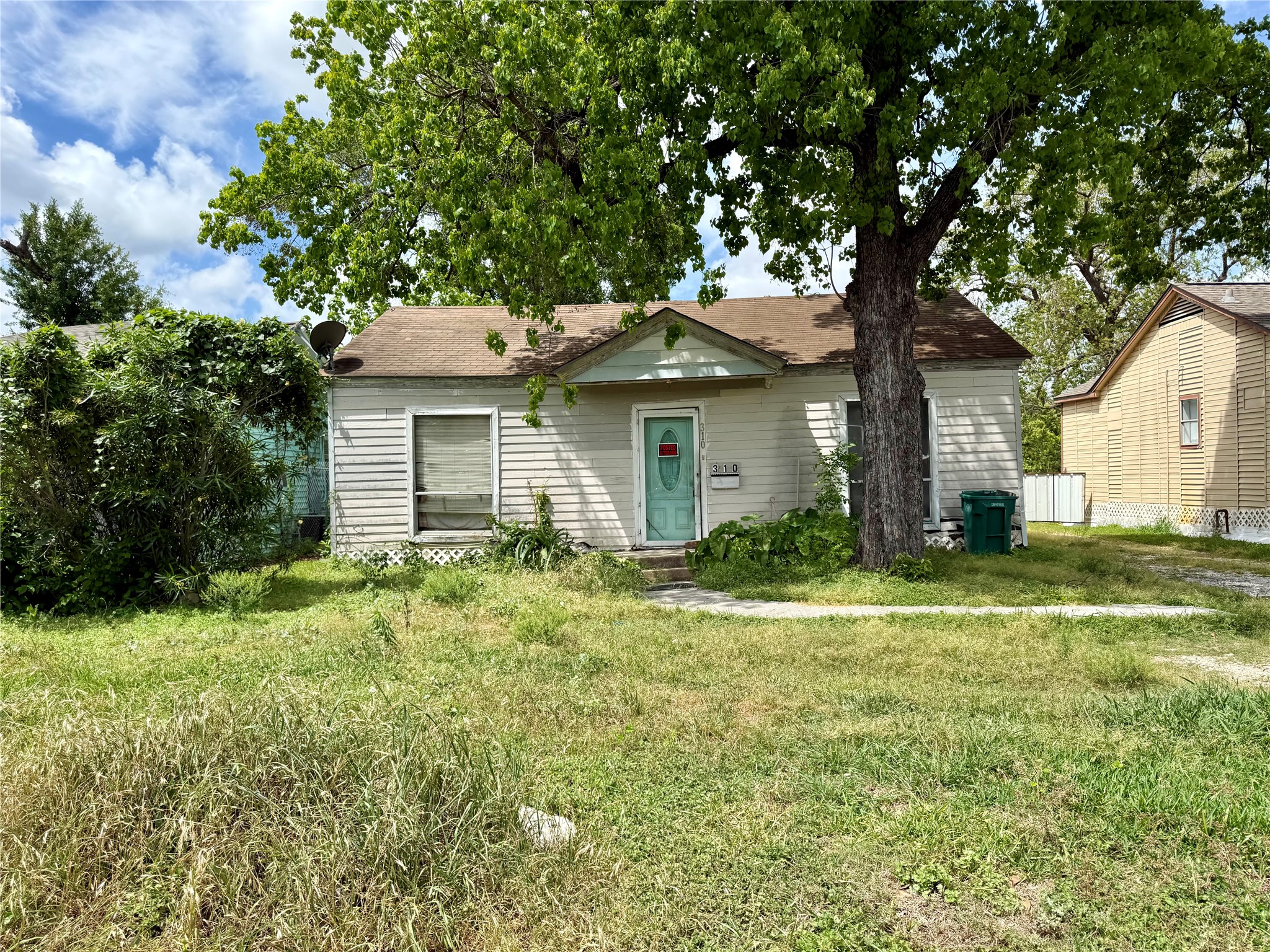 310 Center Street Pasadena, TX 77506 - Photo 1 of 10 a white house that has a tree in front of it