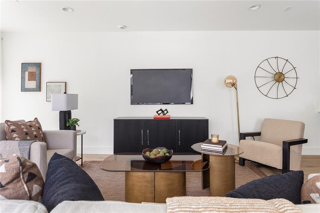 1205 Holly Street Northwest, Unit A Atlanta, GA 30318 - Photo 12 of 74 a living room with furniture and a flat screen tv