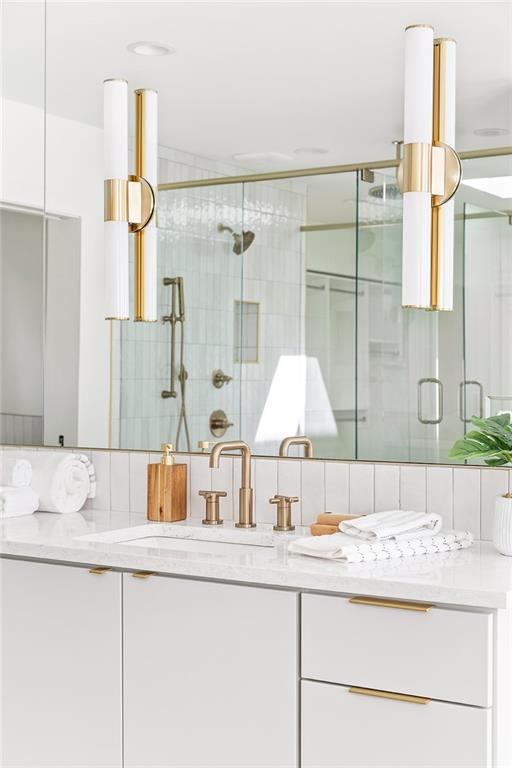 1205 Holly Street Northwest, Unit A Atlanta, GA 30318 - Photo 20 of 74 a bathroom with a granite countertop sink and a mirror