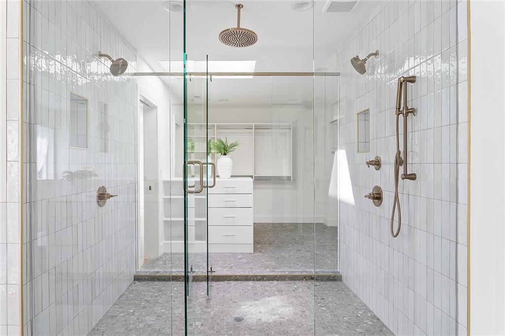 1205 Holly Street Northwest, Unit A Atlanta, GA 30318 - Photo 24 of 74 a bathroom with a glass shower door