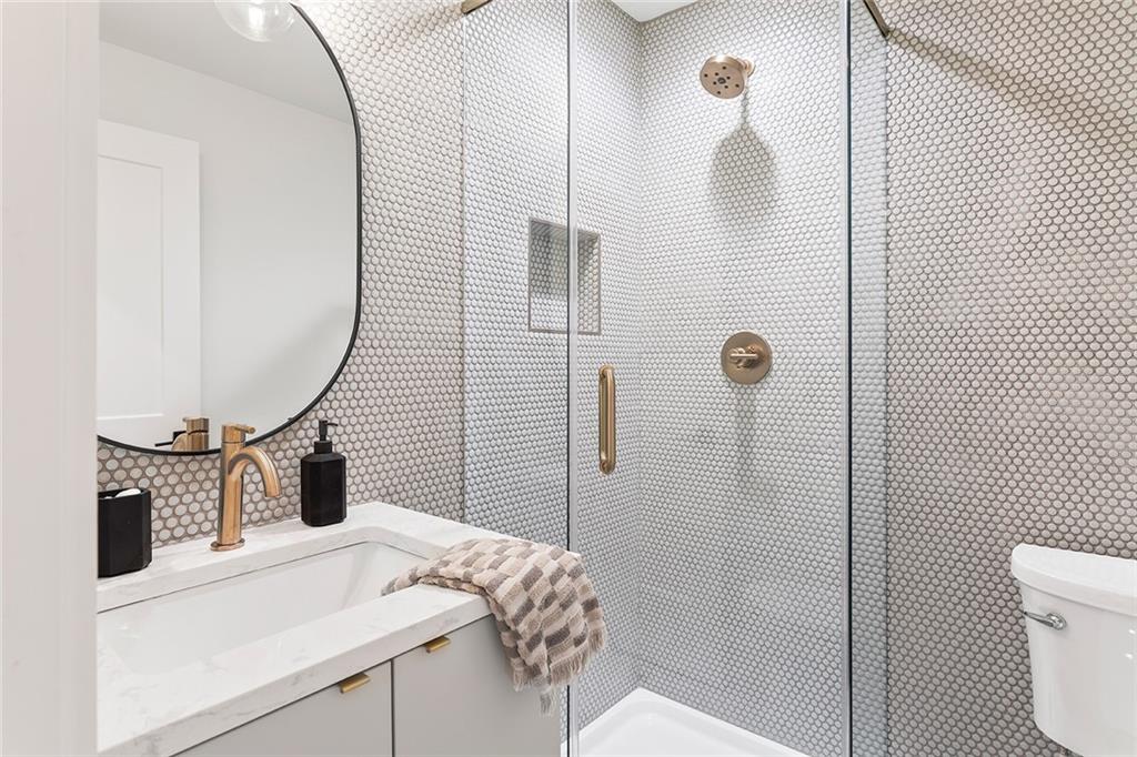 1205 Holly Street Northwest, Unit A Atlanta, GA 30318 - Photo 30 of 74 a bathroom with a sink toilet and shower