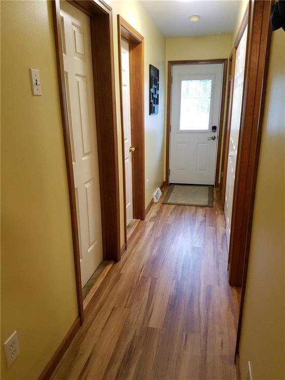 592 Herman Road Butler, PA 16002 - Photo 15 of 24 Hallway that leads to other 2 bedrooms, main floor laundry, storage closets, full bathroom and outside porch access.