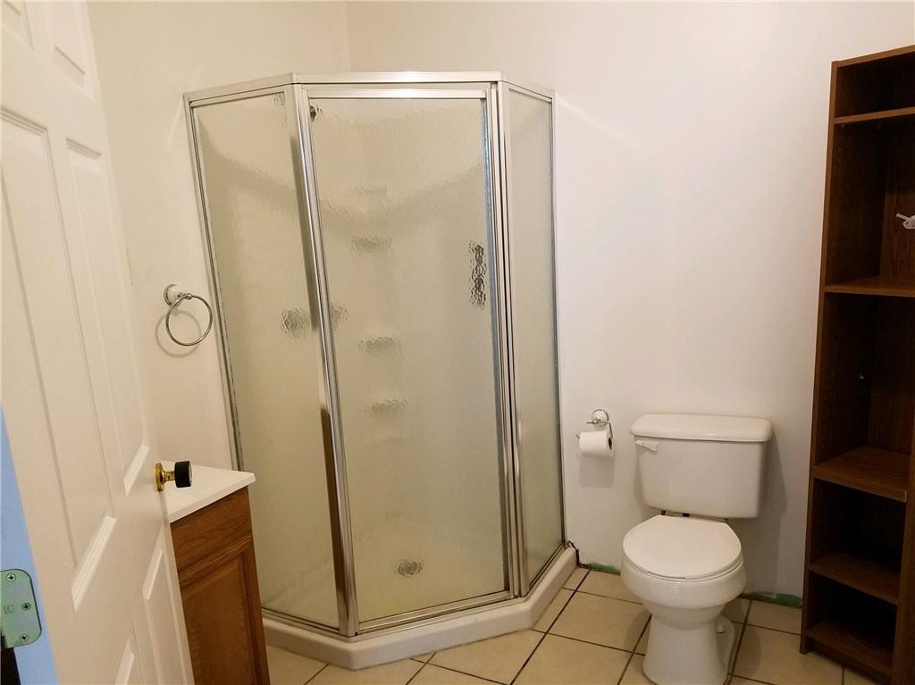 592 Herman Road Butler, PA 16002 - Photo 20 of 24 Basement bathroom is very large and has room for storage.