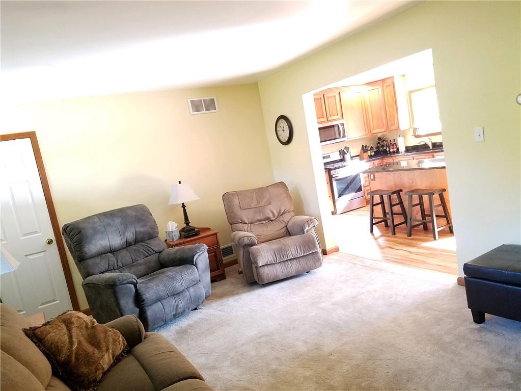 592 Herman Road Butler, PA 16002 - Photo 7 of 24 Living room with coat closet and large opening into the kitchen area.