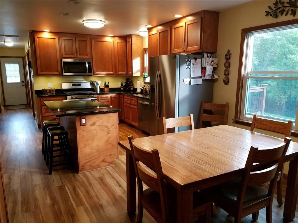592 Herman Road Butler, PA 16002 - Photo 8 of 24 Gorgeous custom Maple kitchen. Black granite countertops and SS appliances. Large windows let so much light in. No curtains needed because the view is flawless.