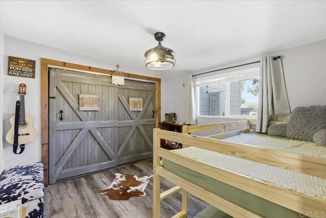 a bedroom with a bed and a table