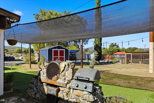 an aerial view of a house with a swimming pool