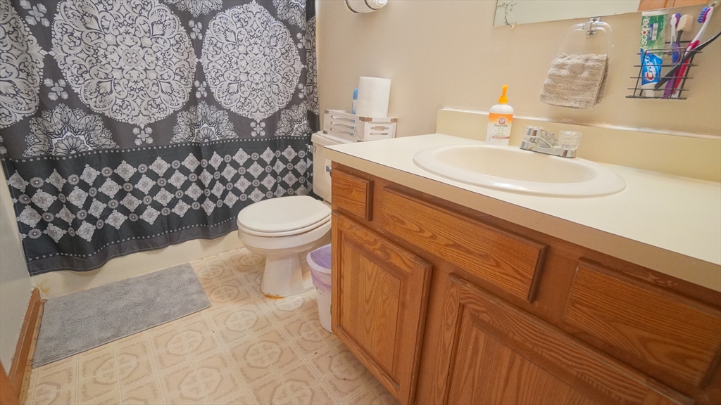 120 Lamplighter Lane, Unit C Springfield, MA 01119 - Photo 11 of 18 a bathroom with a sink a toilet and shower