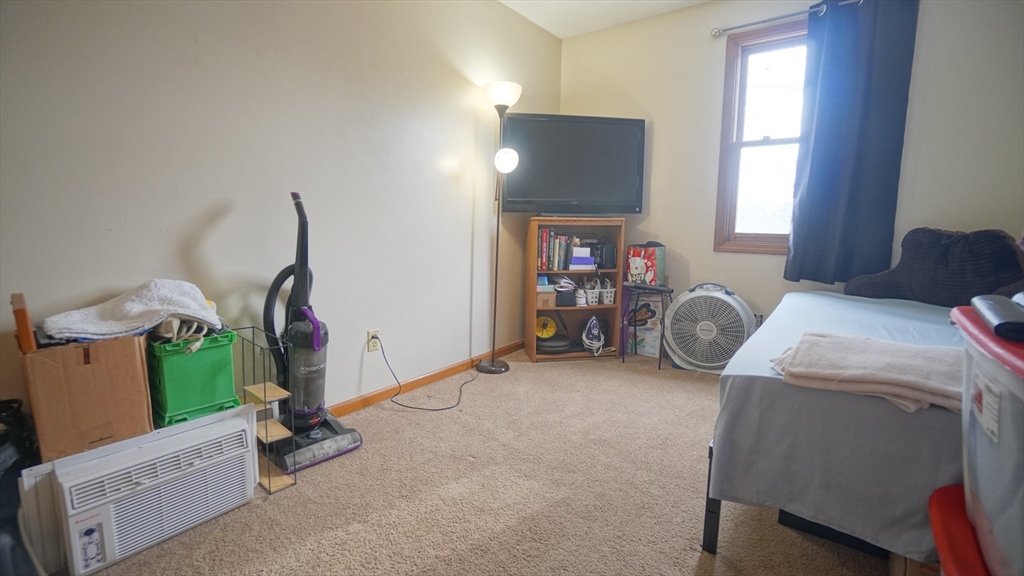 120 Lamplighter Lane, Unit C Springfield, MA 01119 - Photo 12 of 18 a view of livingroom with furniture and a window