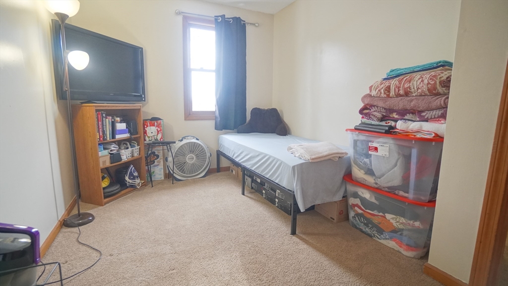 120 Lamplighter Lane, Unit C Springfield, MA 01119 - Photo 13 of 18 a bedroom with bed and a window