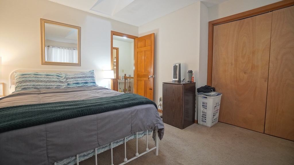 120 Lamplighter Lane, Unit C Springfield, MA 01119 - Photo 16 of 18 a bedroom with a bed and a dresser