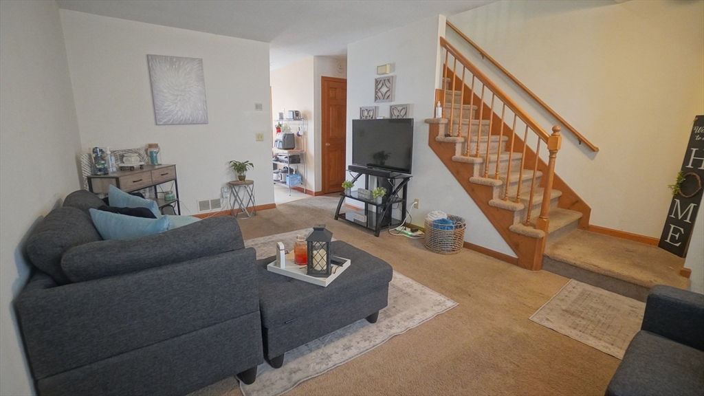 120 Lamplighter Lane, Unit C Springfield, MA 01119 - Photo 10 of 18 a living room with furniture and wooden floor