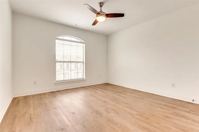 a bathroom with a sink toilet vanity and shower