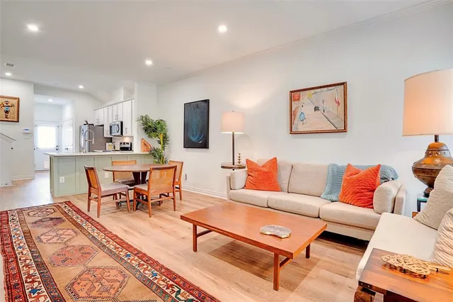 a living room with furniture and a rug
