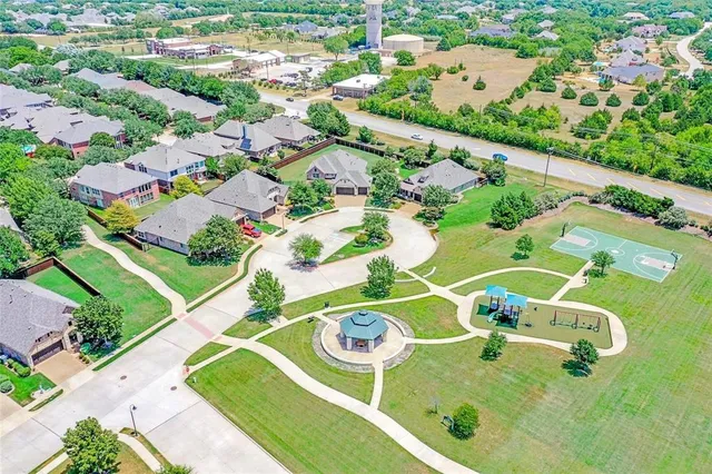 an aerial view of residential houses with outdoor space
