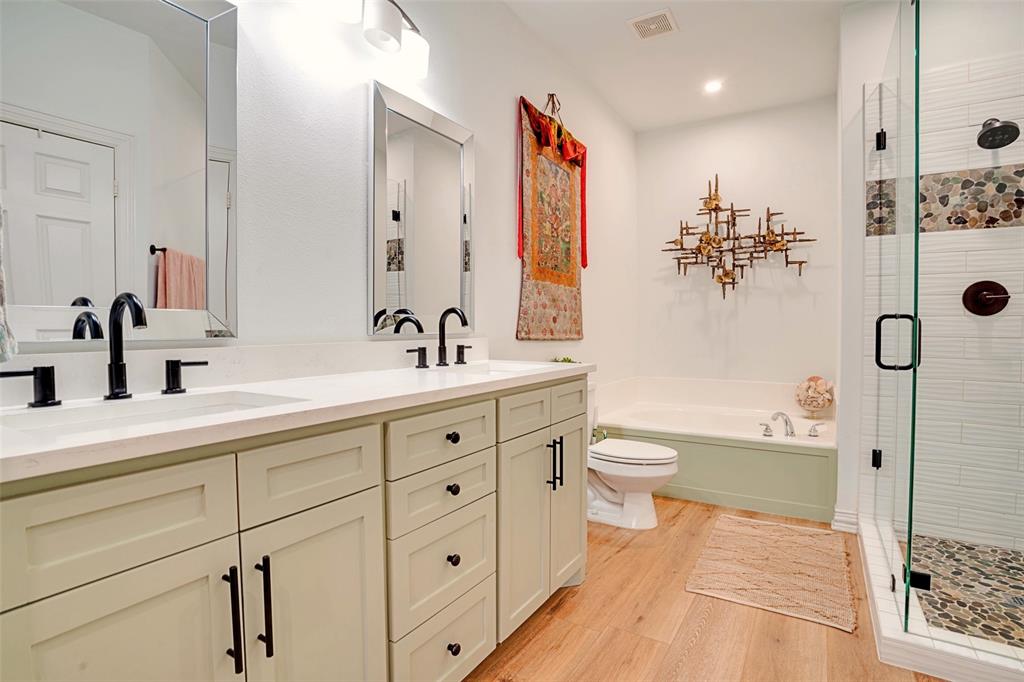 5713 Butterfly Way Fairview, TX 75069 - Photo 10 of 32 a bathroom with a double vanity sink toilet mirror and shower