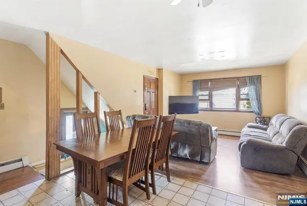 a dining room with furniture and window