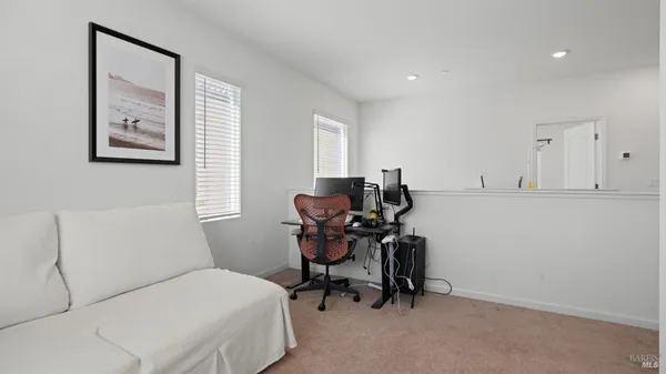 a room with a chair and a desk