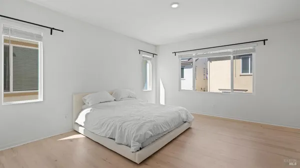 a bedroom with a bed and window