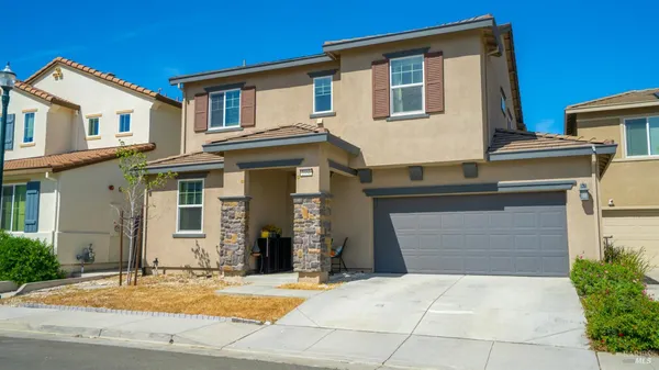 a front view of a house with yard