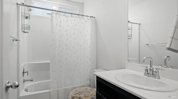 a bathroom with a sink a vanity and a mirror